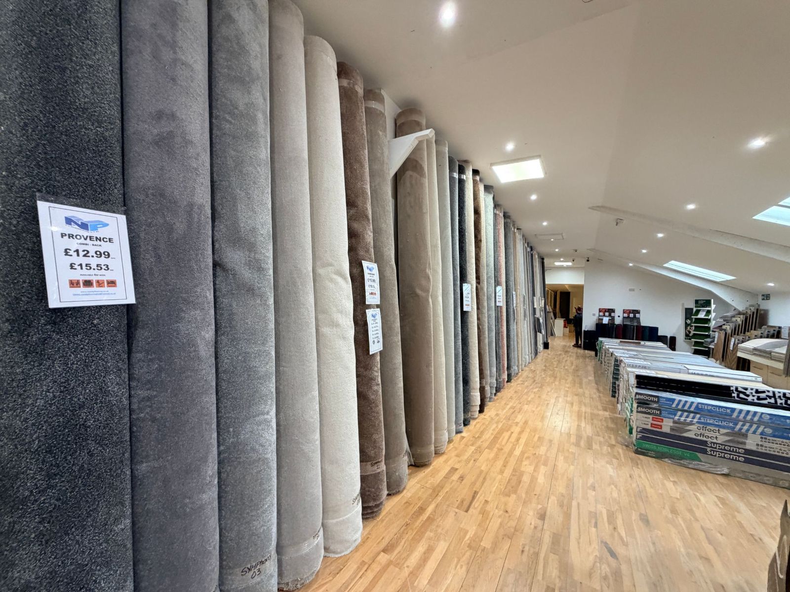 Rows of carpet rolls in the N & P Flooring Glasgow showroom